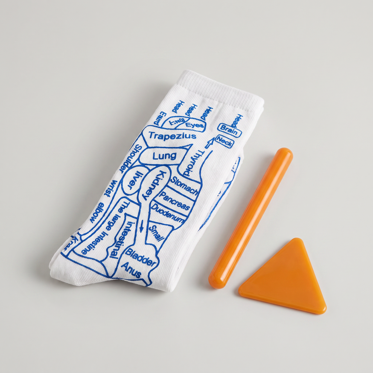 Acupressure Reflexology Socks with massage tools, clean studio product photo